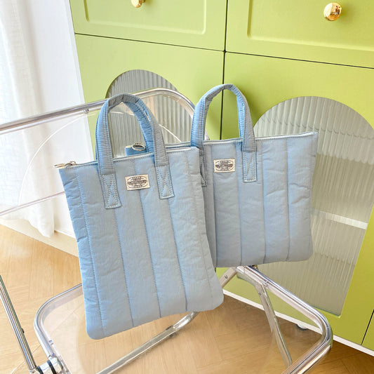 Aesthetic laptop case with soft cozy design, perfect for school