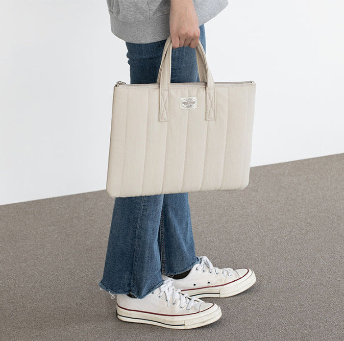 Aesthetic laptop case with soft cozy design, perfect for school